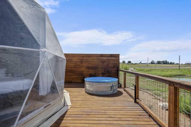 Deck with cowboy pool and countryside views