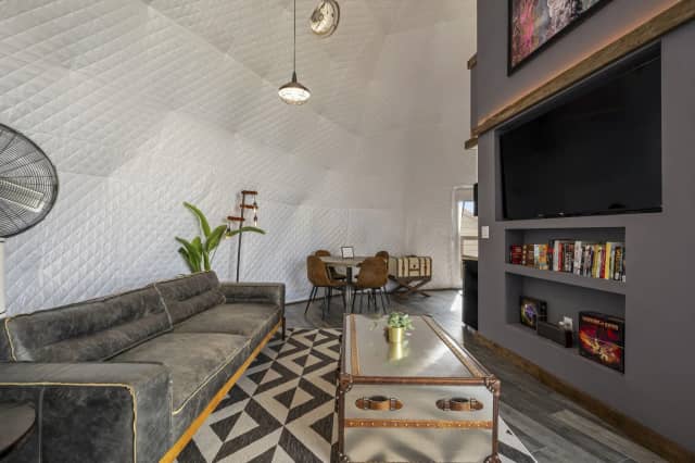 Glamping dome living area with TV