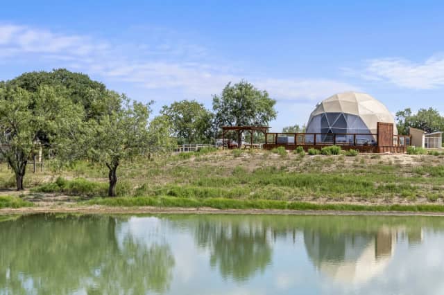 Dome with pond reflection and pergola
