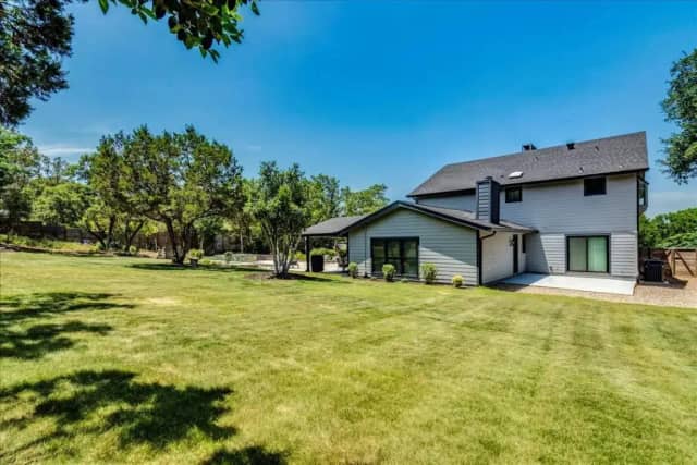 Spacious backyard with mature trees