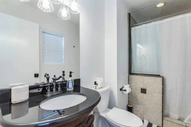Bathroom with black granite vanity