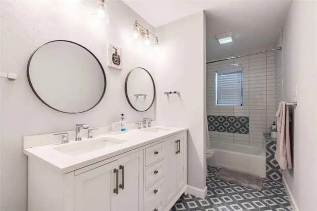 Bathroom with patterned tile floor