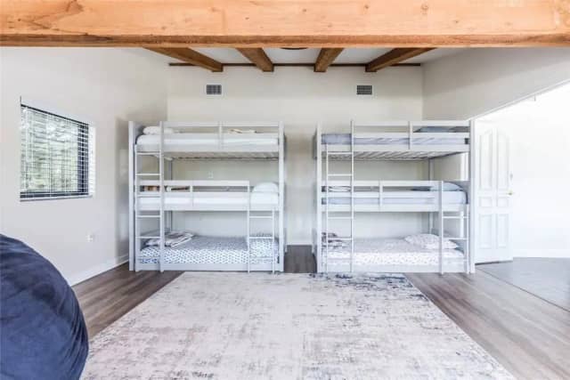 Bunk room with triple bunk beds