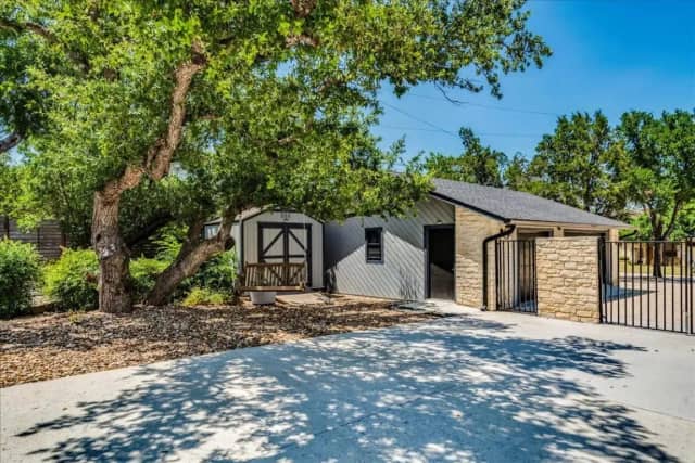 Property entrance with storage building
