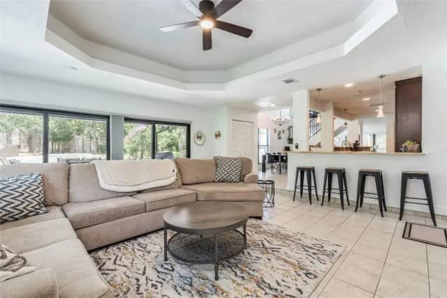 Open living area with kitchen bar seating