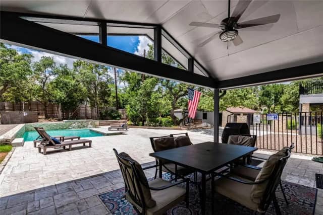 Covered patio with pool and outdoor dining